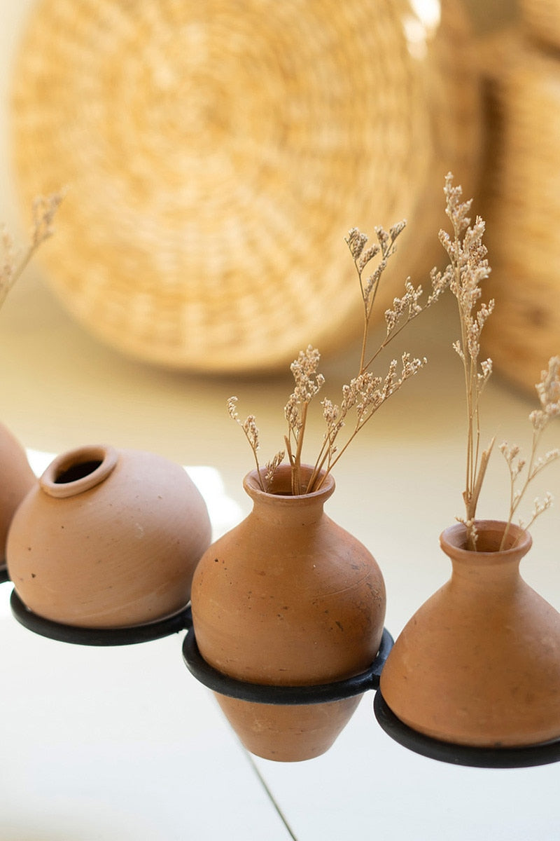 Clay Vessels on an Iron Base