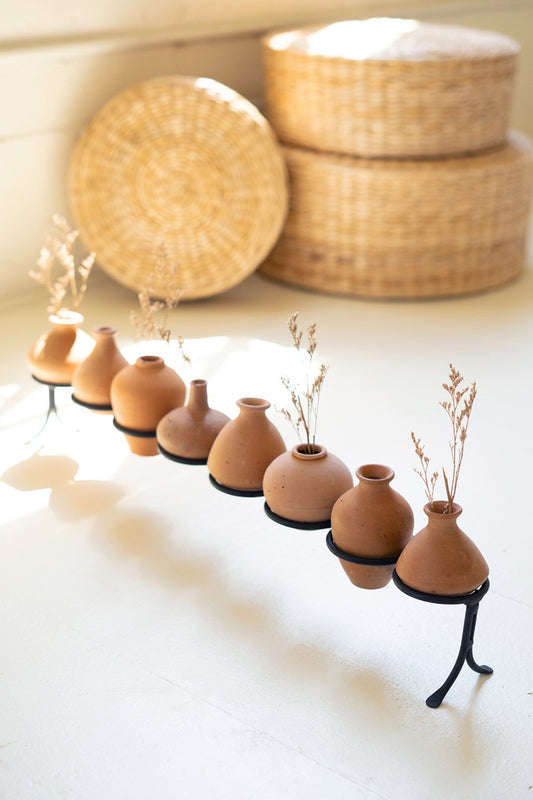 Clay Vessels on an Iron Base
